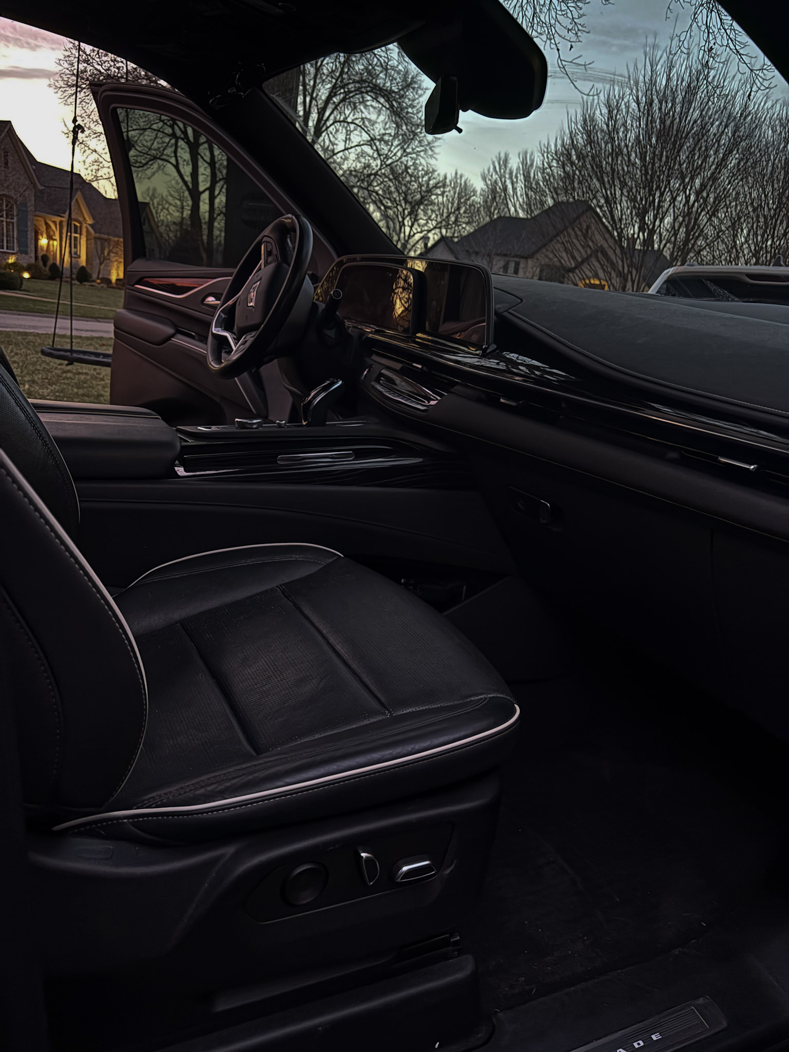 Cadillac Escalade interior detail — spotless leather seats and dashboard by Signature Mobile Detailing